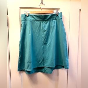 Dark turquoise stretchy play skirt.